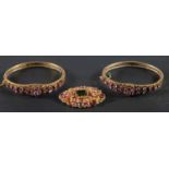 Two Indian, gemset hinged bangles and a brooch, set with vari-coloured,