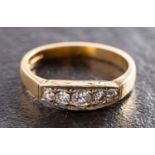 An 18ct gold, round, brilliant-cut diamond, five-stone ring, total estimated diamond weight ca. 0.