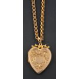 A heart shaped locket pendant, with engraved floral decoration, together with a fancy-link chain,