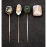 Three tiepins and a brooch, including mother-of-pearl and beetle tiepins, both stamped 'STERLING',