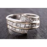 WITHDRAWN An 18ct gold and princess-cut diamond three-row, cross-over ring,
