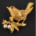 A 9ct gold brooch depicting a song bird on a branch, with cultured pearl berries, diameter ca. 3.