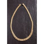 A 9ct gold, brick-link fringe necklace, with import marks for London 1975, total length ca.