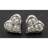 A pair of Tiffany, heart-shaped, round, brilliant-cut diamond ear studs, total diamond weight 0.