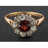 A garnet and old-cut diamond cluster ring, estimated garnet weight ca. 0.