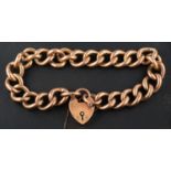 A curb-link bracelet with heart-shaped clasp, the clasp stamped '9CT', the links stamped '9C',