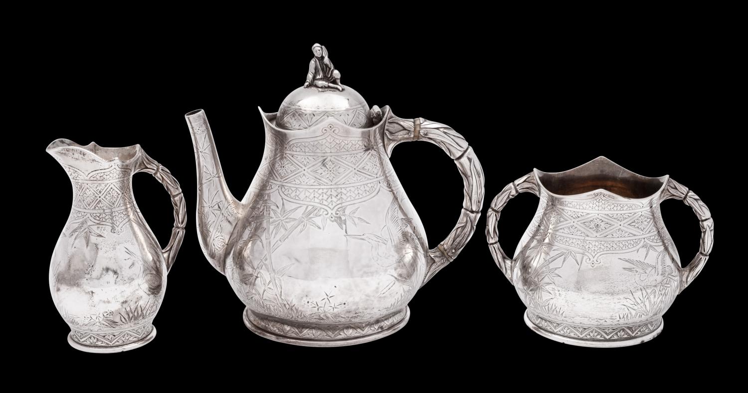 An Aesthetic movement silver three-piece tea service, maker Elkington & Co, London,