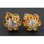 A pair of cushion-cut diamond ear studs, estimated total diamond weight ca. 1.