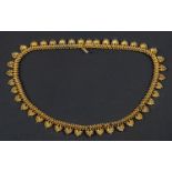 An Etruscan Revival palmette fringe necklace, with cannetille work, total length ca. 44.