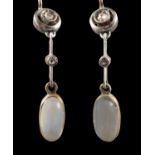 A pair of oval, cabochon-cut moonstone and rose-cut diamond drop earrings, with Russian fastenings,