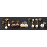Four pairs of earrings and an ear stud, including a pair of ruby and diamond cluster earrings,