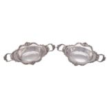 A pair of late Victorian silver twin-handled sweetmeat dishes,