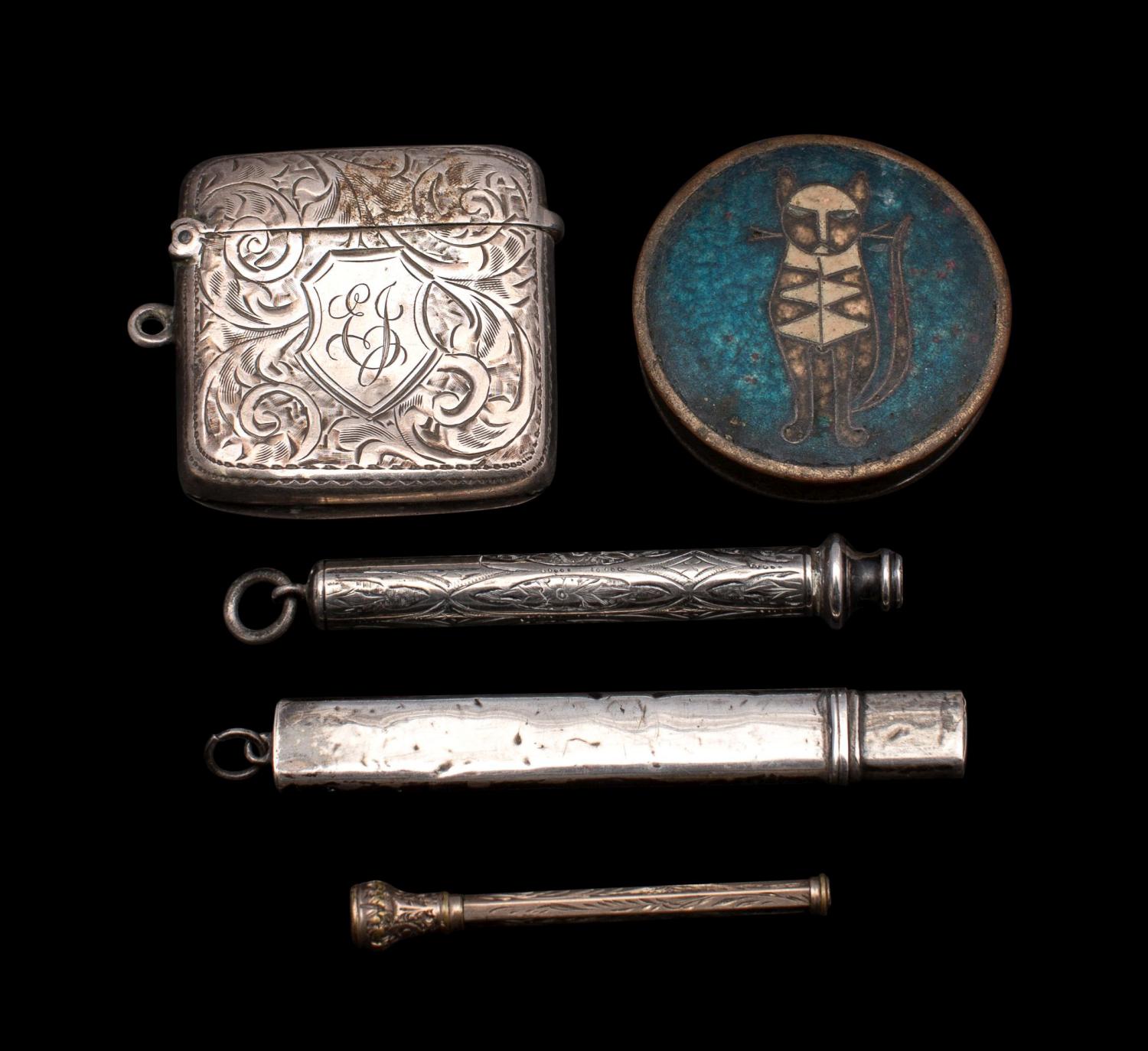 A mixed collection of silver items, including a vesta case,