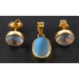 An oval, cabochon-cut moonstone pendant and pair of ear studs, the ear studs with post fittings,