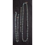 Three chains of round, mixed-cut spectacle-set blue zircons, lengths ca.