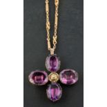 A 19th century, quatrefoil, foil backed amethyst pendant, together with a fancy-link chain,