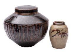 *David Leach [1911-2005] a stoneware jar and cover of shouldered form the sides with fluted