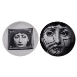Two Fornasetti Tema e Variazioni wall plates one printed with stitched visage [n.