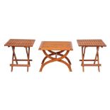 A pair of teak folding occasional tables,