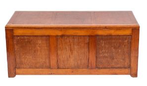 A pitch pine trunk, mid 20th century; the three panel hinged top above a conforming front,