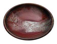 *Francois Dudouit, [Contemporary] a stoneware bowl under sang de boeuf and ivory glazes,