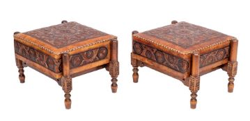 A pair of tooled leather and walnut rectangular stools,