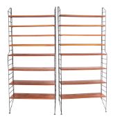A pair of teak and metal mounted floor standing shelving units, almost certainly Robert Heal,
