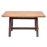 An oak trestle table in Arts & Crafts taste,