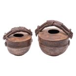 Two stoneware vessels by an unknown hand in imitation of an Oriental water container,