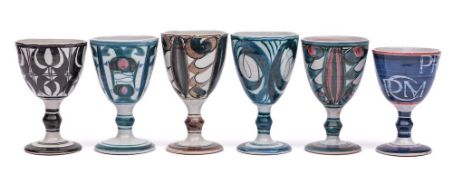 Aldermaston Pottery a group of six terracotta goblets each with brushwork decoration,