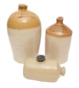 Two Honey top spirit jars and a hot water bottle, the largest stamped 'Wright & Son, Grocers,