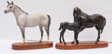 A Beswick Connoisseur model 'Black Beauty and Foal' on wooden base, 20cm high,