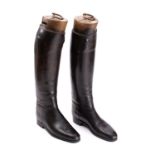 A pair of Maxwell black leather riding boots with wooden trees.