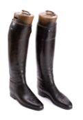 A pair of Maxwell black leather riding boots with wooden trees.