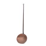 A large 19th Century copper skimmer with 40cm diameter pan and iron handle with ring terminal, 149.