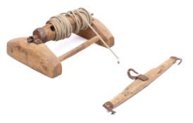 A butcher's pig hoist with rope attached barrel and separate iron mounted beam, 55cm wide.