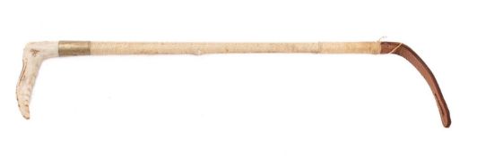 A Swaine antler handled riding crop with silver plated ferrule and cord bound shaft.