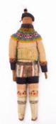 An early 20th century Greenlandic Inuit carved wooden doll:,