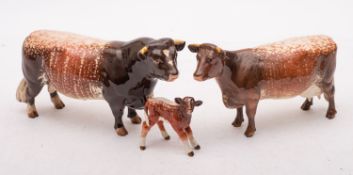 A group of Beswick cattle comprising a Dairy Shorthorn cow, Champion Eaton Wide Eyes 91st,