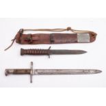 An Italian 1891 pattern bayonet stamped 'B142 to hilt with two piece wooden grip,
