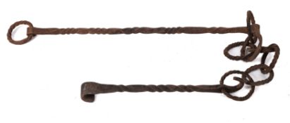 A single wrought iron pot hook: with spiral rings and stems.