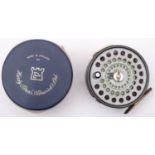 A Hardy 'St Andrew' 4 inch alloy fly reel, ebonised handle, tension screw to rim and brass foot,