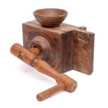 A 19th Century French fruitwood grain mill with grinding handle and bowl surmount, 34cm long.