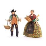 A pair of early 20th century Swiss onion or garlic seller dolls,