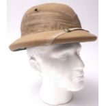 An Ango-Indian Pith helmet, label to interior ' Express Yead & Co' 53cm.