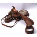A brown leather Western style saddle, 55cm long.