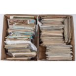 An accumulation of early to late 20th century British topographical postcards in two boxes,