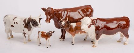 A group of Beswick cattle comprising an Ayrshire cow, Champion Ickham Bessie, Ayrshire bull,