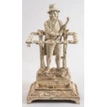 A cast iron 'Ireland' umbrella stand: the backplate depicting an 18th century Irishman wearing