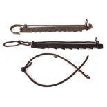Two wrought iron adjustable pot hooks of serrated design,